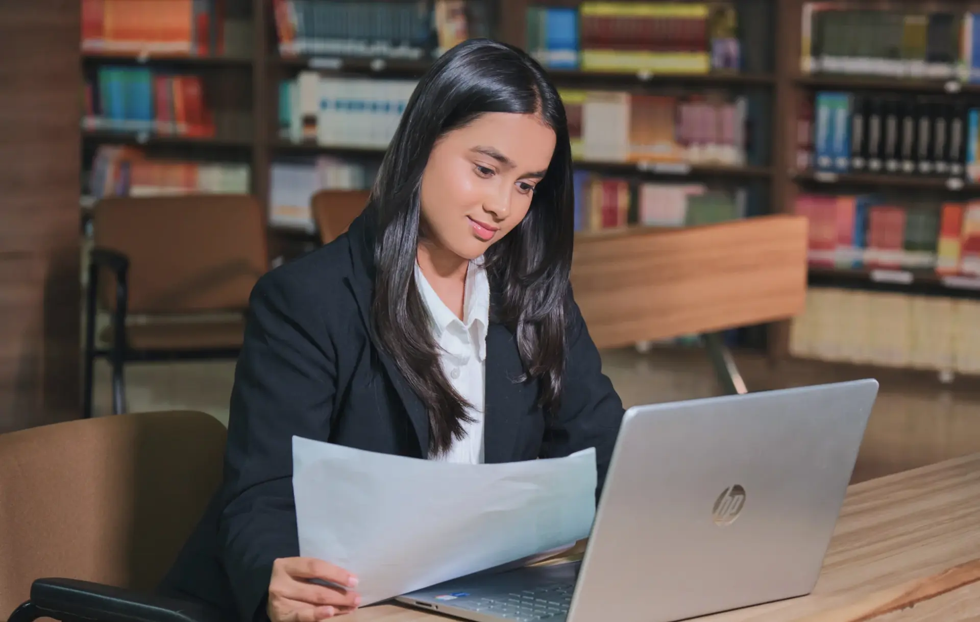 Student researching in the modern KRMU central library