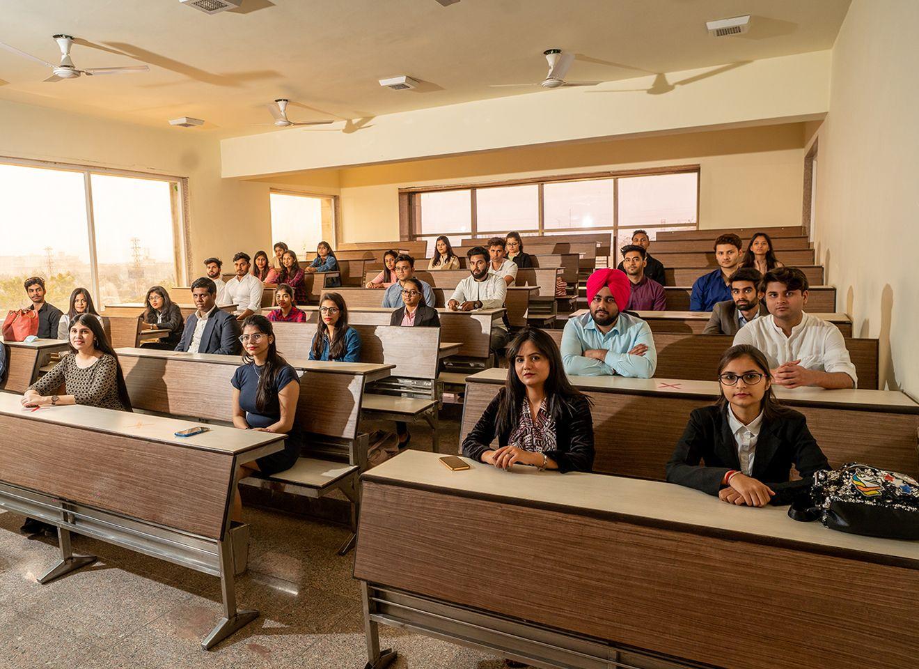 Faculty and students studying classical and contemporary political theory, governance, and policy-making in a classroom at KRMU
