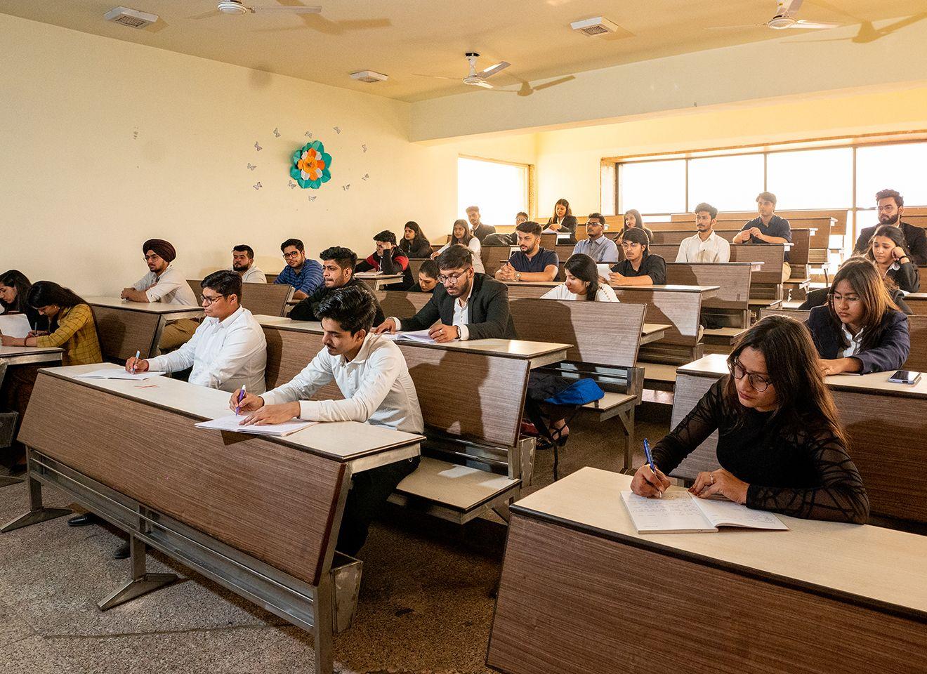 B.A. English students in a competitive exam coaching session for Banking, Insurance, Railways, and SSC at KRMU