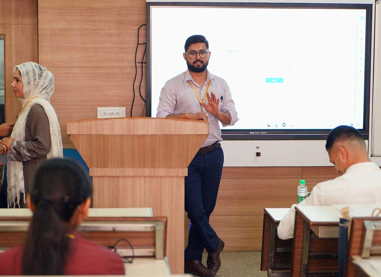 Faculty and students reviewing the B.A. English (Hons. with Research) curriculum at KRMU