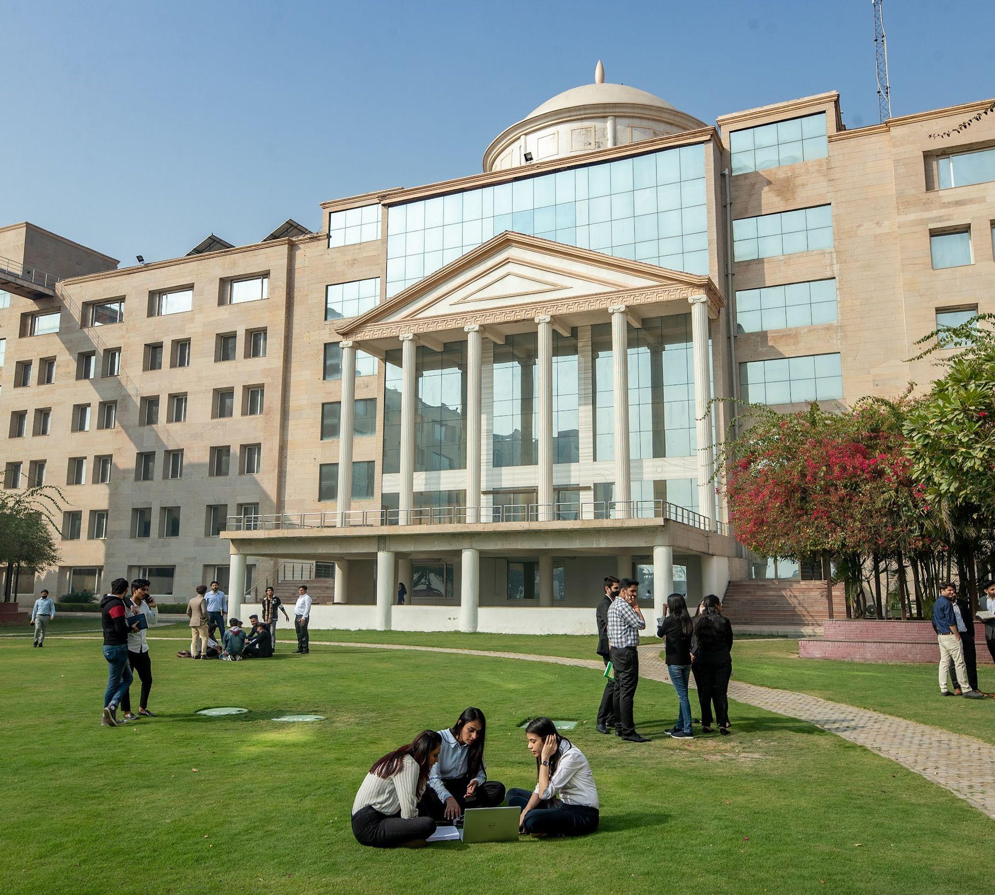 K.R. Mangalam University campus dome building with students, Sohna Road Gurugram
