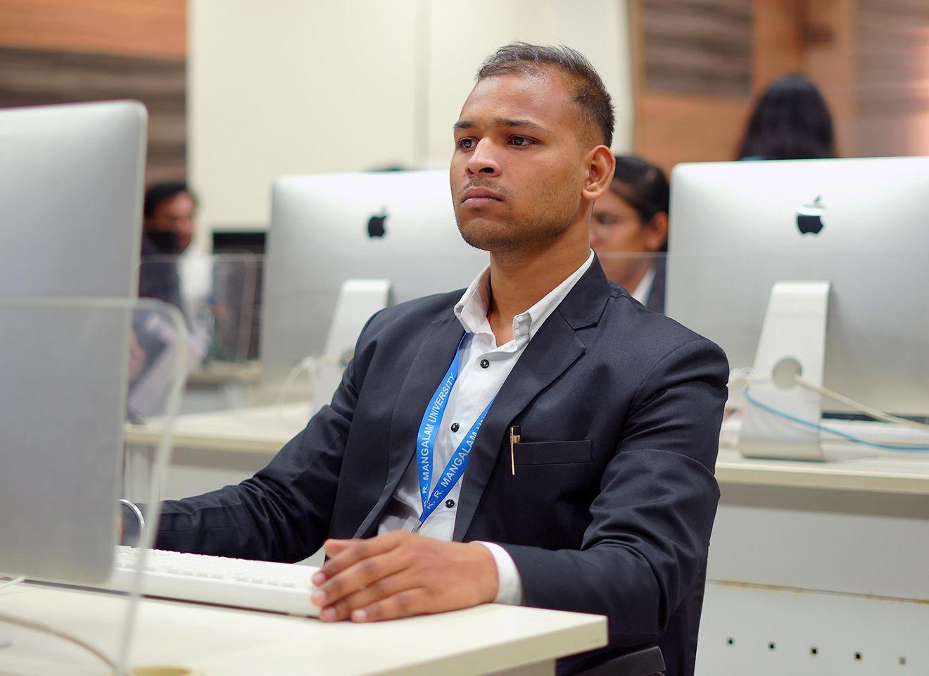 B.A. Economics students using Excel, Stata, R, or Python for data analysis and economic modelling in a computer lab at KRMU