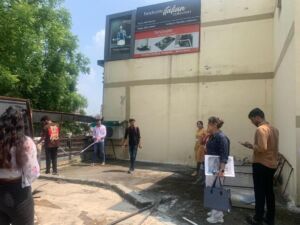Students taking measurements at the site visit